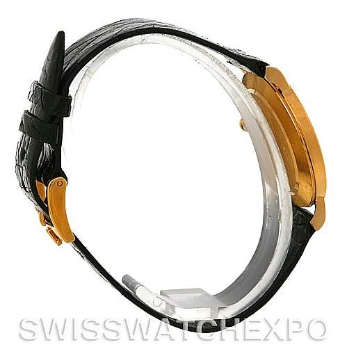 The image shows a side view of the Rolex Cellini 5112 Men
s Yellow Gold Champagne Dial 5112 Men
s Yellow Gold Champagne Dial watch, highlighting its case, crown, and leather strap.