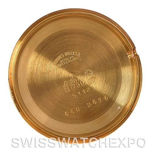 This is the inner case back of a Rolex Cellini 5112 Men
s Yellow Gold Champagne Dial 5112 Men
s Yellow Gold Champagne Dial watch shown from the inside, displaying various engravings and markings.