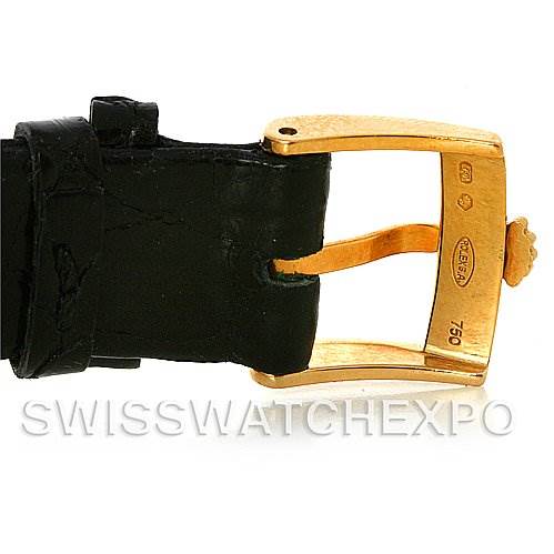 The image shows a close-up of the Rolex Cellini 5112 Men
s Yellow Gold Champagne Dial 5112 Men
s Yellow Gold Champagne Dial watch
s gold buckle and black leather strap.