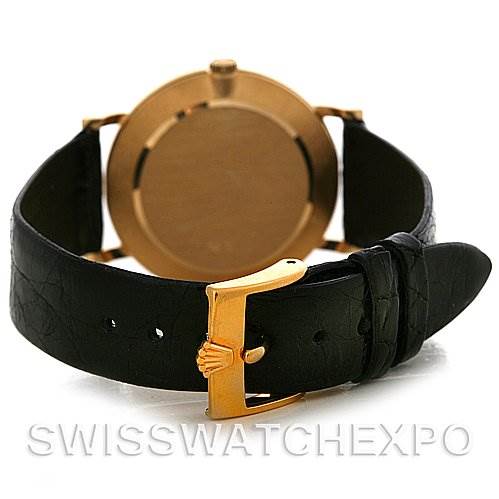 The image shows the back of a Rolex Cellini 5112 Men
s Yellow Gold Champagne Dial 5112 Men
s Yellow Gold Champagne Dial watch, focusing on the leather strap and gold buckle.