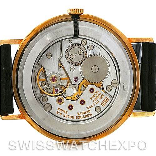 This image shows the back view of a Rolex Cellini 4112 Yellow Gold White Dial 4112 Yellow Gold White Dial model, displaying its intricate internal mechanical movement.