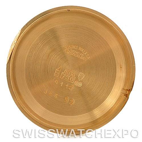 This image shows the interior case back of a Rolex Cellini 4112 Yellow Gold White Dial 4112 Yellow Gold White Dial watch, featuring engravings and hallmarks.