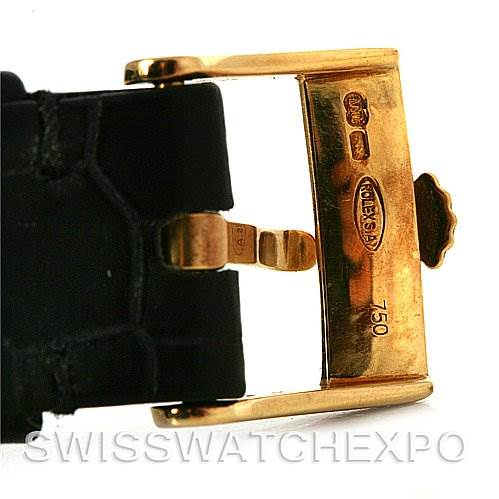 The image shows a close-up of the gold clasp and part of the black leather strap of a Rolex Cellini 4112 Yellow Gold White Dial 4112 Yellow Gold White Dial watch.