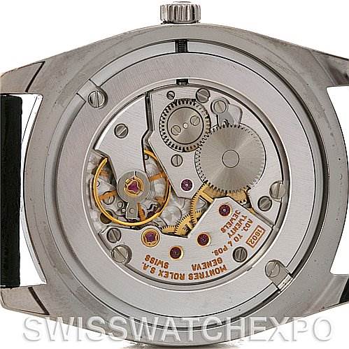 This image shows the back view of a Rolex Cellini 4233 Men's White Gold Black Dial 4233 Men's White Gold Black Dial watch, highlighting its intricate mechanical movement and various internal components.