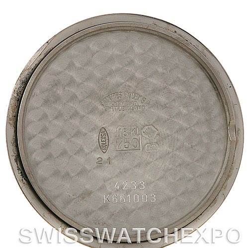 The image shows the inside of the caseback of a Rolex Cellini 4233 Men
s White Gold Black Dial 4233 Men
s White Gold Black Dial watch, displaying various engravings and markings.