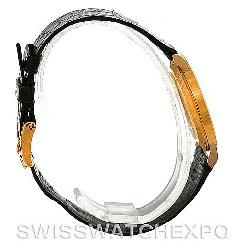 The image shows a side view of a Rolex Cellini 5112 Men's Yellow Gold White Dial 5112 Men's Yellow Gold White Dial watch, highlighting the leather strap, buckle, and gold case.