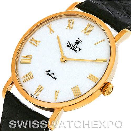 The image shows a close-up, angled view of the Rolex Cellini 5112 Men's Yellow Gold White Dial 5112 Men's Yellow Gold White Dial watch face, including its gold-tone case, Roman numeral markers, and black leather strap.