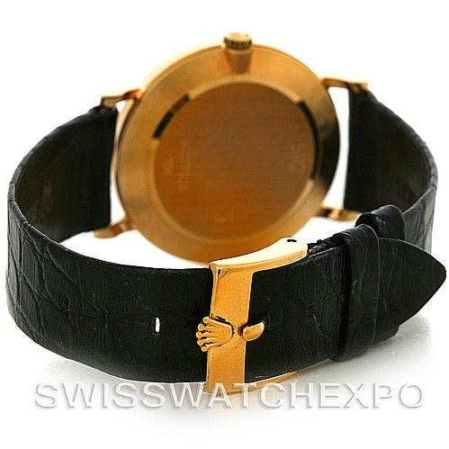 The image shows the back view of a Rolex Cellini 5112 Men's Yellow Gold White Dial 5112 Men's Yellow Gold White Dial watch, highlighting the case back, leather strap, and the gold buckle clasp.