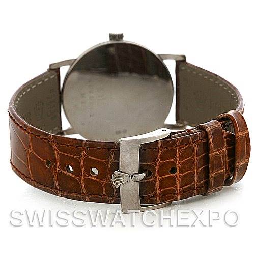 The Rolex Cellini 5115 Men's White Gold Silver Dial 5115 Men's White Gold Silver Dial watch is shown from the back, highlighting the brown leather strap and clasp.