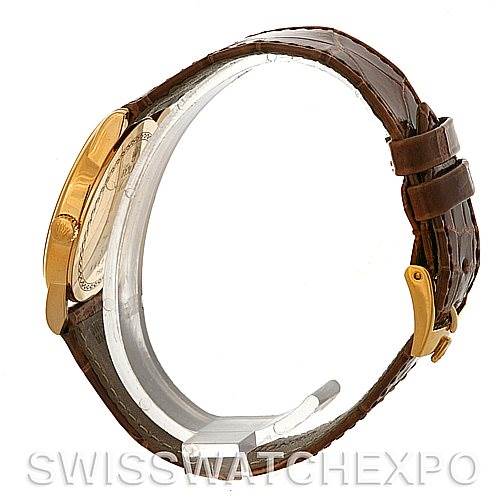 The image shows a side view of a Rolex Cellini 5116 Men's Yellow Gold Grey Dial 5116 Men's Yellow Gold Grey Dial watch, highlighting the leather strap, gold case, and buckle.