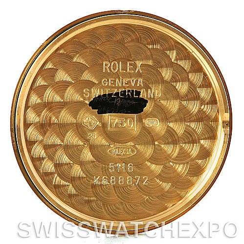 This image shows the case back of a Rolex Cellini 5116 Men's Yellow Gold Grey Dial 5116 Men's Yellow Gold Grey Dial watch, displaying engravings and hallmark stamps.