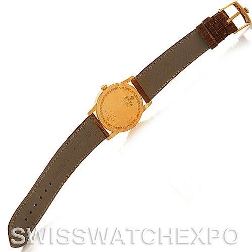 This image shows the back view of a Rolex Cellini 5116 Men's Yellow Gold Grey Dial 5116 Men's Yellow Gold Grey Dial watch with a leather strap and a visible rectangular clasp.