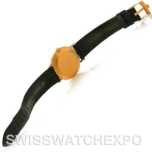 The image shows the back view of a Rolex Cellini 4112 Yellow Gold White Dial 4112 Yellow Gold White Dial watch, displaying its leather strap and gold-colored case.