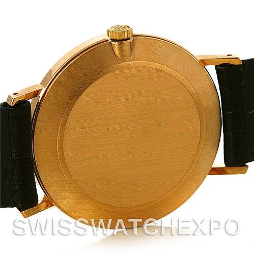 The image shows the back case and lugs of a Rolex Cellini 4112 Yellow Gold White Dial 4112 Yellow Gold White Dial watch, showcasing its gold finish and leather straps from a rear angle.