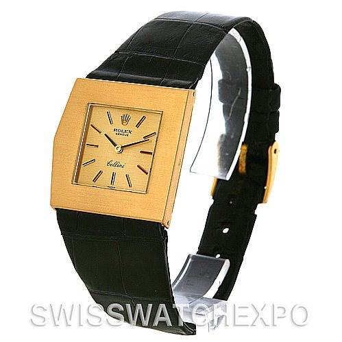 The image shows a front angle of a Rolex Cellini 4017 Men
s Yellow Gold Champagne Dial 4017 Men
s Yellow Gold Champagne Dial watch, highlighting its gold square dial and black leather strap.