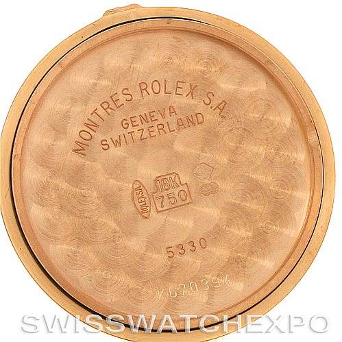 This image shows the inner case back of a Rolex Cellini 5330/5 Men's Rose Gold White Dial 5330/5 Men's Rose Gold White Dial watch, displaying engravings and hallmarks.