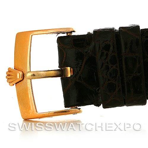 This image shows a close-up of the gold buckle and black leather strap of a Rolex Cellini 5330/5 Men's Rose Gold White Dial 5330/5 Men's Rose Gold White Dial watch.