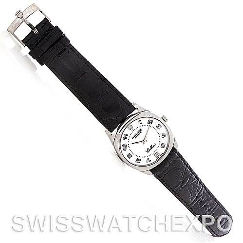 The image shows a Rolex Cellini 4233 Men
s White Gold White Dial 4233 Men
s White Gold White Dial watch at a top-down angle, displaying the dial, strap, buckle, and brand detailing.