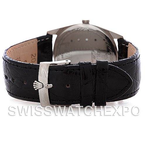 The image shows the back of the Rolex Cellini 4233 Men
s White Gold White Dial 4233 Men
s White Gold White Dial watch with a focus on its black leather strap and buckle.