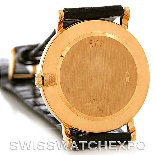 This image shows the back view of a Rolex Cellini 5112 Men's Yellow Gold Beige Dial 5112 Men's Yellow Gold Beige Dial watch featuring a gold case and black leather strap.