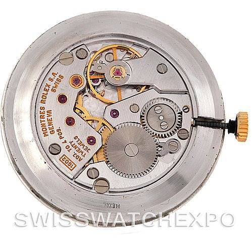 This image shows the internal mechanical components of a Rolex Cellini 5112 Men's Yellow Gold Beige Dial 5112 Men's Yellow Gold Beige Dial watch, including gears, cogs, and the winding crown, viewed from the back.