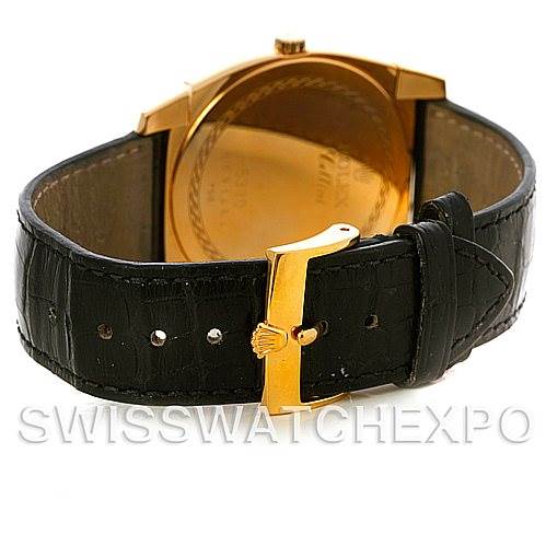 This image shows the back of a Rolex Cellini 5330 Men
s Yellow Gold White Dial 5330 Men
s Yellow Gold White Dial watch, including its gold case back and black leather strap with a gold buckle.