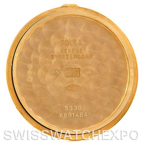 The image shows the inside case back of a Rolex Cellini 5330 Men
s Yellow Gold White Dial 5330 Men
s Yellow Gold White Dial watch, displaying model numbers and hallmarks.