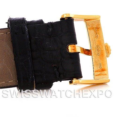 The image shows a close-up of the black leather strap and gold buckle of a Rolex Cellini 5330 Men
s Yellow Gold White Dial 5330 Men
s Yellow Gold White Dial watch.