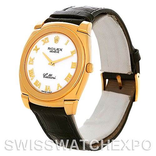 This Rolex Cellini 5330 Men
s Yellow Gold White Dial 5330 Men
s Yellow Gold White Dial watch is shown at an angle revealing the gold case, dial, leather strap, and buckle.