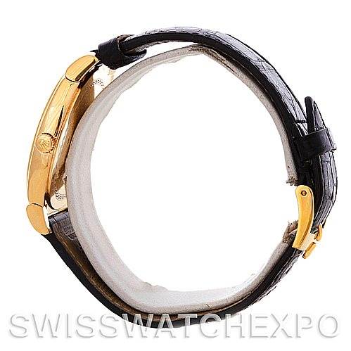 The image shows a side profile of the Rolex Cellini 5330 Men
s Yellow Gold White Dial 5330 Men
s Yellow Gold White Dial watch, highlighting its gold case, crown, and black leather strap with a buckle.