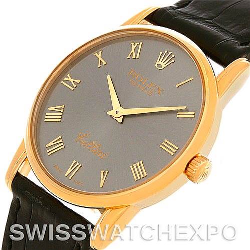 The image shows an angled view of the dial, bezel, crown, and part of the strap of a Rolex Cellini 5116 Men
s Yellow Gold Grey Dial 5116 Men
s Yellow Gold Grey Dial watch.
