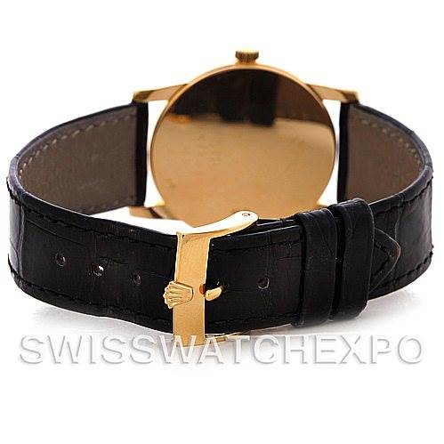 The image shows the back view of a Rolex Cellini 5116 Men
s Yellow Gold Grey Dial 5116 Men
s Yellow Gold Grey Dial watch, highlighting the black leather strap and gold buckle.