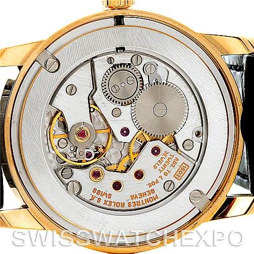 This image shows the back view of a Rolex Cellini 5116 Men
s Yellow Gold Grey Dial 5116 Men
s Yellow Gold Grey Dial watch, highlighting its intricate movement and inner mechanics.