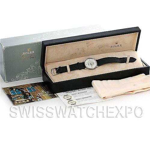 The Rolex Cellini 5115 Men's White Gold Silver Dial 5115 Men's White Gold Silver Dial watch is presented in its box, along with a booklet, documents, and a cleaning cloth, viewed from an overhead angle.