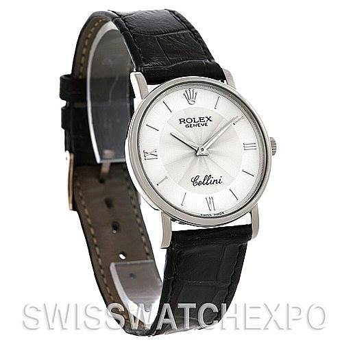 The Rolex Cellini 5115 Men's White Gold Silver Dial 5115 Men's White Gold Silver Dial watch is shown at a slight left angle, displaying its face, leather strap, and side crown.