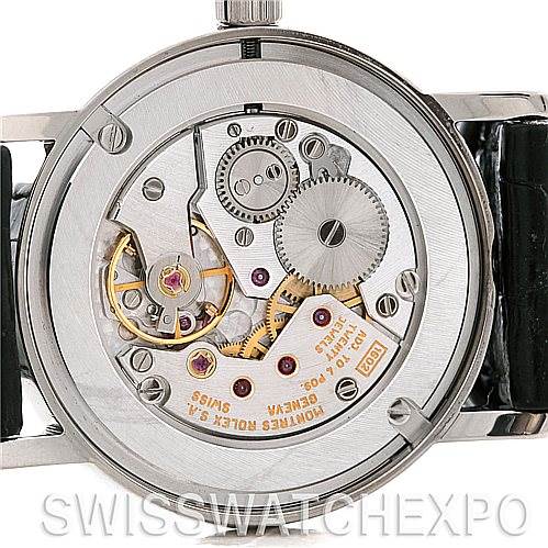 The image shows the back view of a Rolex Cellini 5115 Men's White Gold Silver Dial 5115 Men's White Gold Silver Dial model, highlighting its intricate mechanical movement parts.
