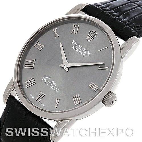 The image shows a Rolex Cellini 5116 Men's White Gold Grey Dial 5116 Men's White Gold Grey Dial watch from a front angle, highlighting its silver dial, Roman numerals, and black leather strap.