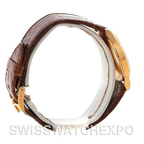 Side view of a Rolex Cellini 5116 Men's Yellow Gold Mother of Pearl Dial 5116 Men's Yellow Gold Mother of Pearl Dial watch, showcasing its brown leather strap and gold clasp.