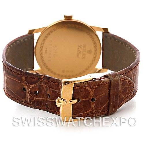 The image shows the back angle of a Rolex Cellini 5116 Men's Yellow Gold Mother of Pearl Dial 5116 Men's Yellow Gold Mother of Pearl Dial watch, highlighting its brown leather strap and gold clasp.