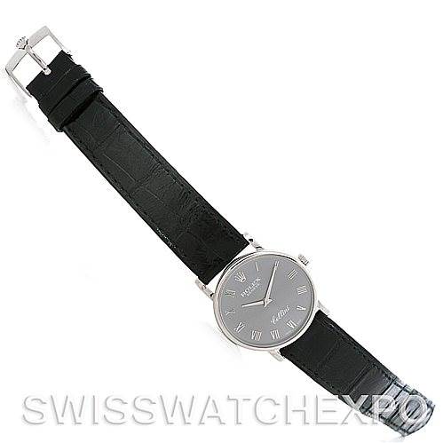 This image shows a Rolex Cellini 5115 Men's White Gold Grey Dial 5115 Men's White Gold Grey Dial watch from a top-down angle, highlighting the entire watch including its dial, case, and leather strap.