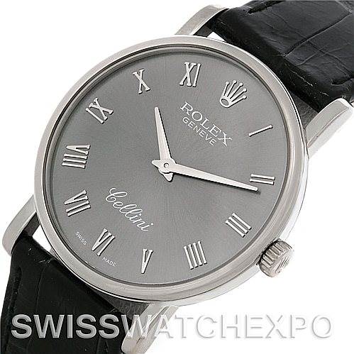 The image shows a Rolex Cellini 5115 Men's White Gold Grey Dial 5115 Men's White Gold Grey Dial watch from a top-down angle, highlighting its dial, hands, Roman numerals, and black leather strap.