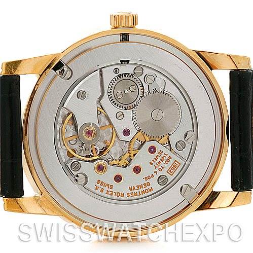 This image shows the back view of a Rolex Cellini 5116 Men's Yellow Gold Silver Dial 5116 Men's Yellow Gold Silver Dial watch, highlighting its internal movement and mechanical components.