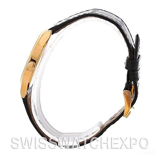 This image shows a side view of the Rolex Cellini 5116 Men's Yellow Gold Silver Dial 5116 Men's Yellow Gold Silver Dial watch, highlighting the gold case, leather strap, and clasp.