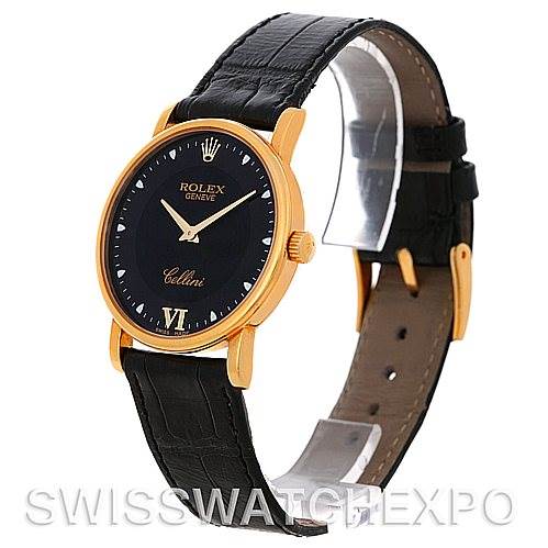 The Rolex Cellini 5115 Men's Yellow Gold Black Dial 5115 Men's Yellow Gold Black Dial watch is shown at a three-quarter angle, highlighting its black dial, gold case, crown, and black leather strap.