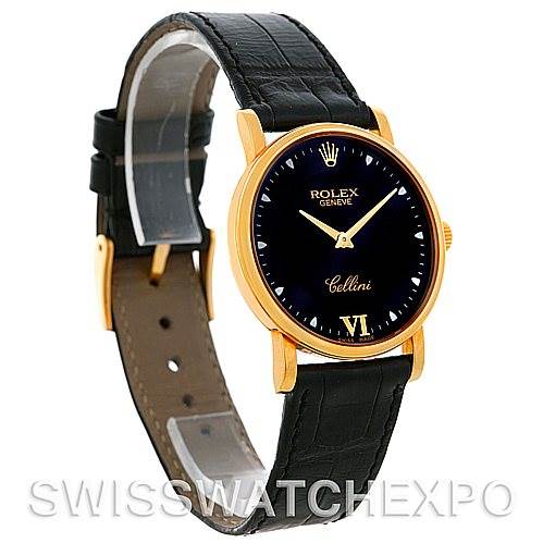 The Rolex Cellini 5115 Men's Yellow Gold Black Dial 5115 Men's Yellow Gold Black Dial watch is shown at a slight angle displaying its black leather strap, gold case, and dark dial with branding visible.