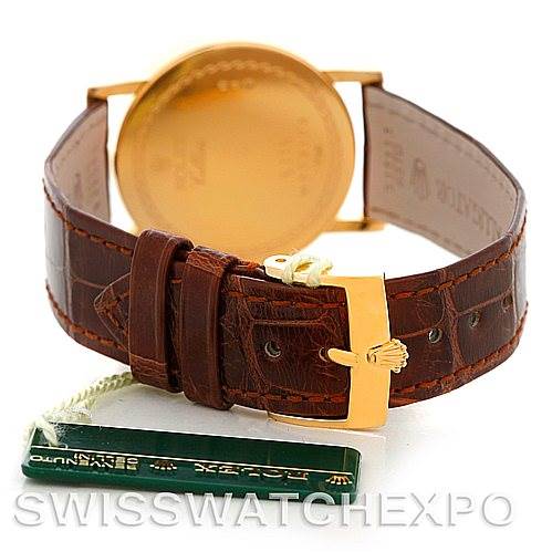 This image shows the back of a Rolex Cellini 5115 Men's Yellow Gold Silver Dial 5115 Men's Yellow Gold Silver Dial watch, focusing on the leather strap and gold buckle.