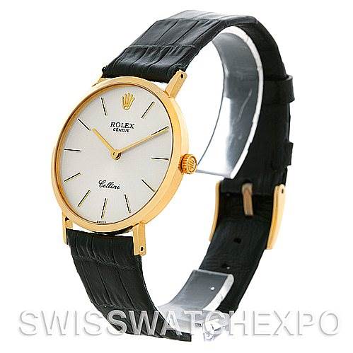This image shows a side angle of a Rolex Cellini 4112 Men's Yellow Gold Silver Dial 4112 Men's Yellow Gold Silver Dial watch displaying its gold case, white dial, and black leather strap.