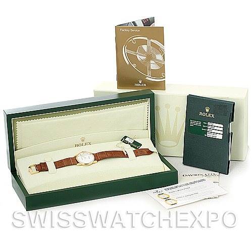 This image shows a Rolex Cellini 5116 Men's Yellow Gold Mother of Pearl Dial 5116 Men's Yellow Gold Mother of Pearl Dial watch with a leather strap in its open presentation box, along with a booklet, cards, and other accessories.