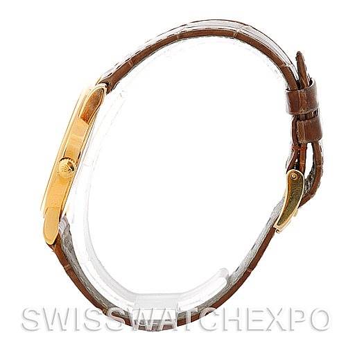 The image shows a side view of a Rolex Cellini 5116 Men's Yellow Gold Mother of Pearl Dial 5116 Men's Yellow Gold Mother of Pearl Dial watch with a brown leather strap and gold case.