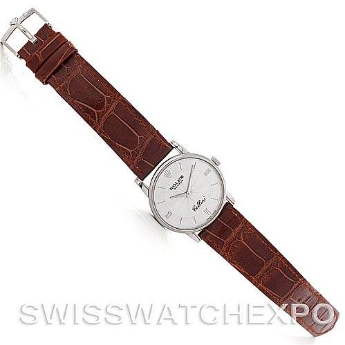 The image shows a top-down view of a Rolex Cellini 5116 Men's White Gold Silver Dial 5116 Men's White Gold Silver Dial watch with a brown leather strap and a silver dial.